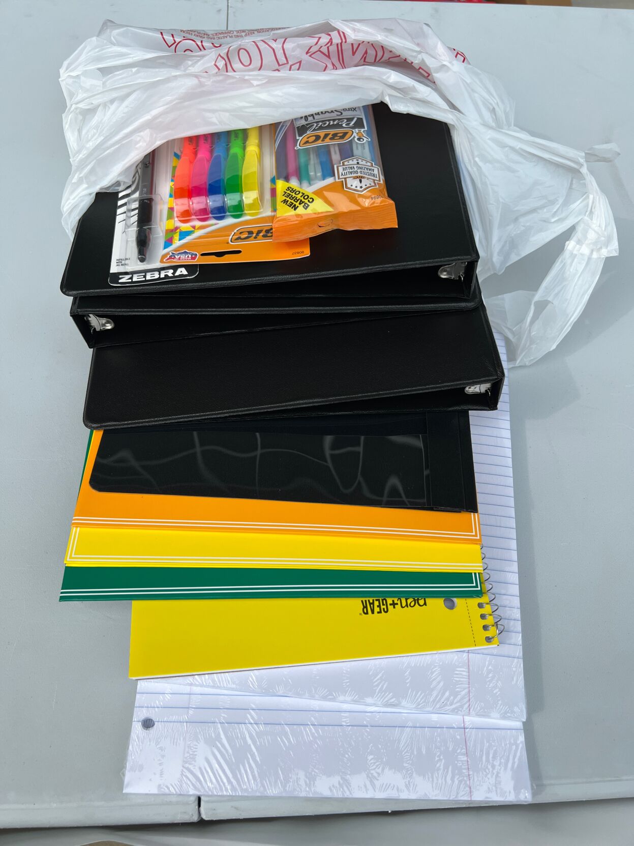 The supply packages included binders, folders, paper and writing utensils.